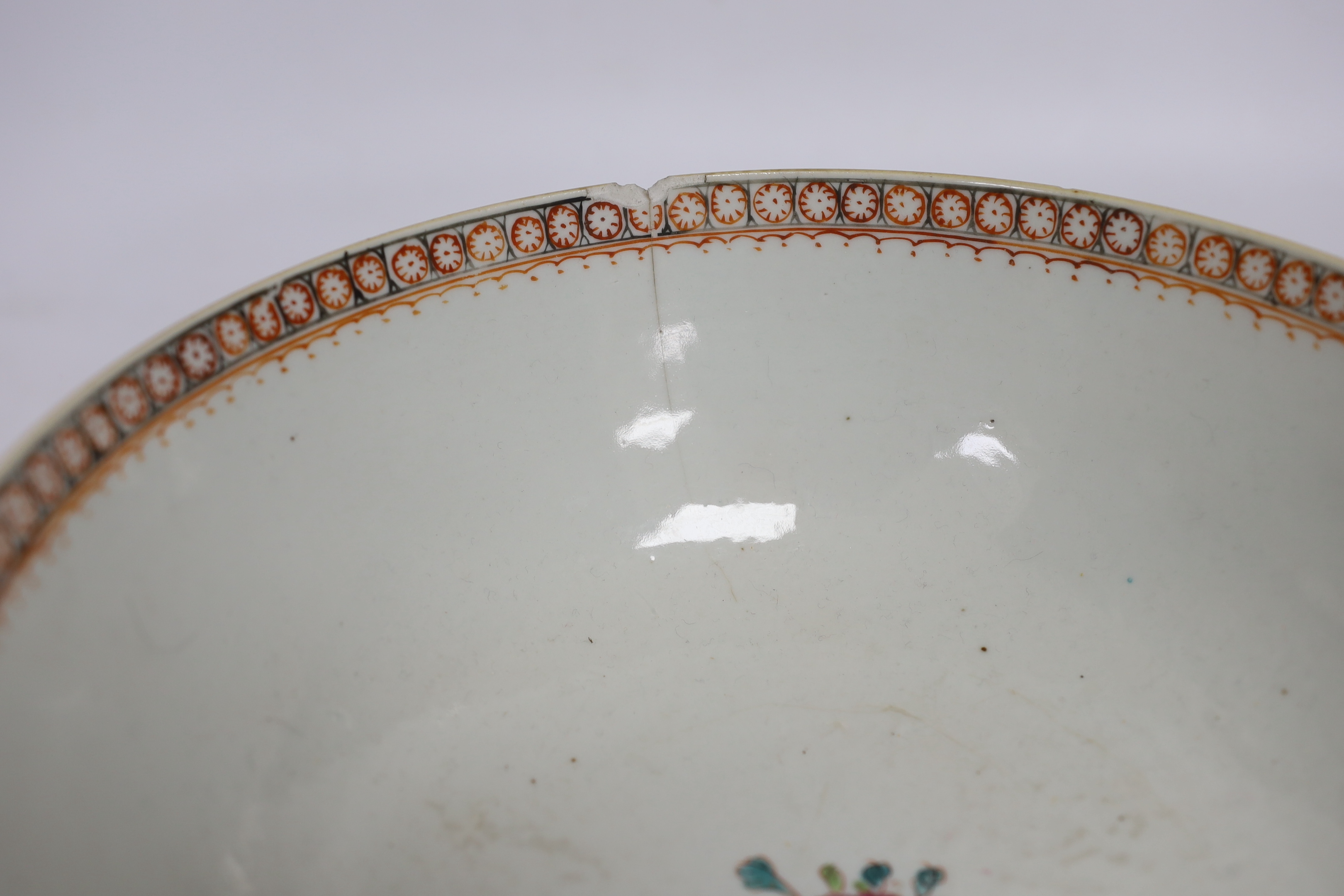 A Chinese Qianlong blue and white garlic neck vase and a famille rose bowl, 18th century largest 26cm in diameter